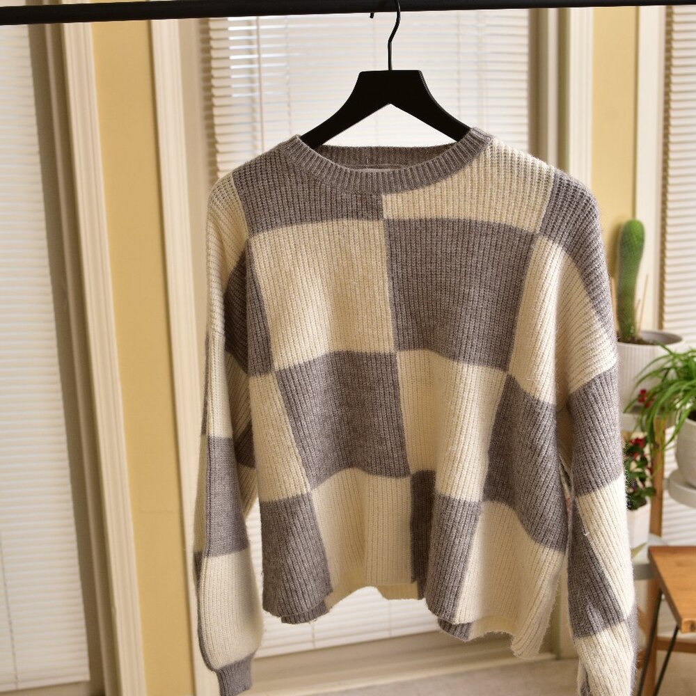 gray and white checkered sweater